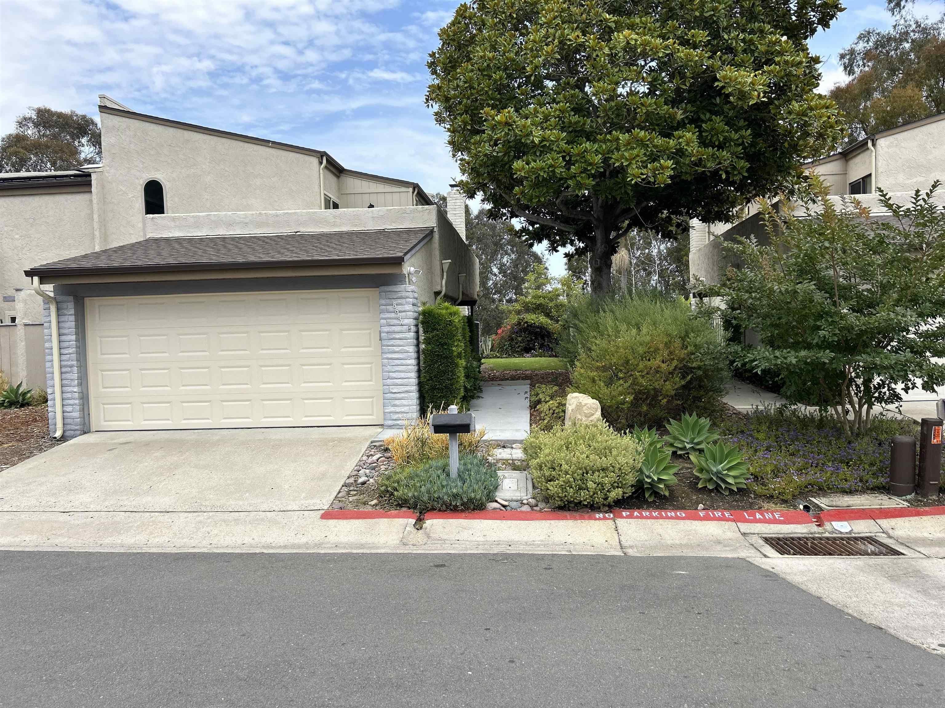 a house with a yard and garage