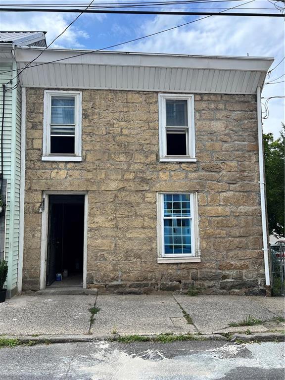 a front view of a house with garage