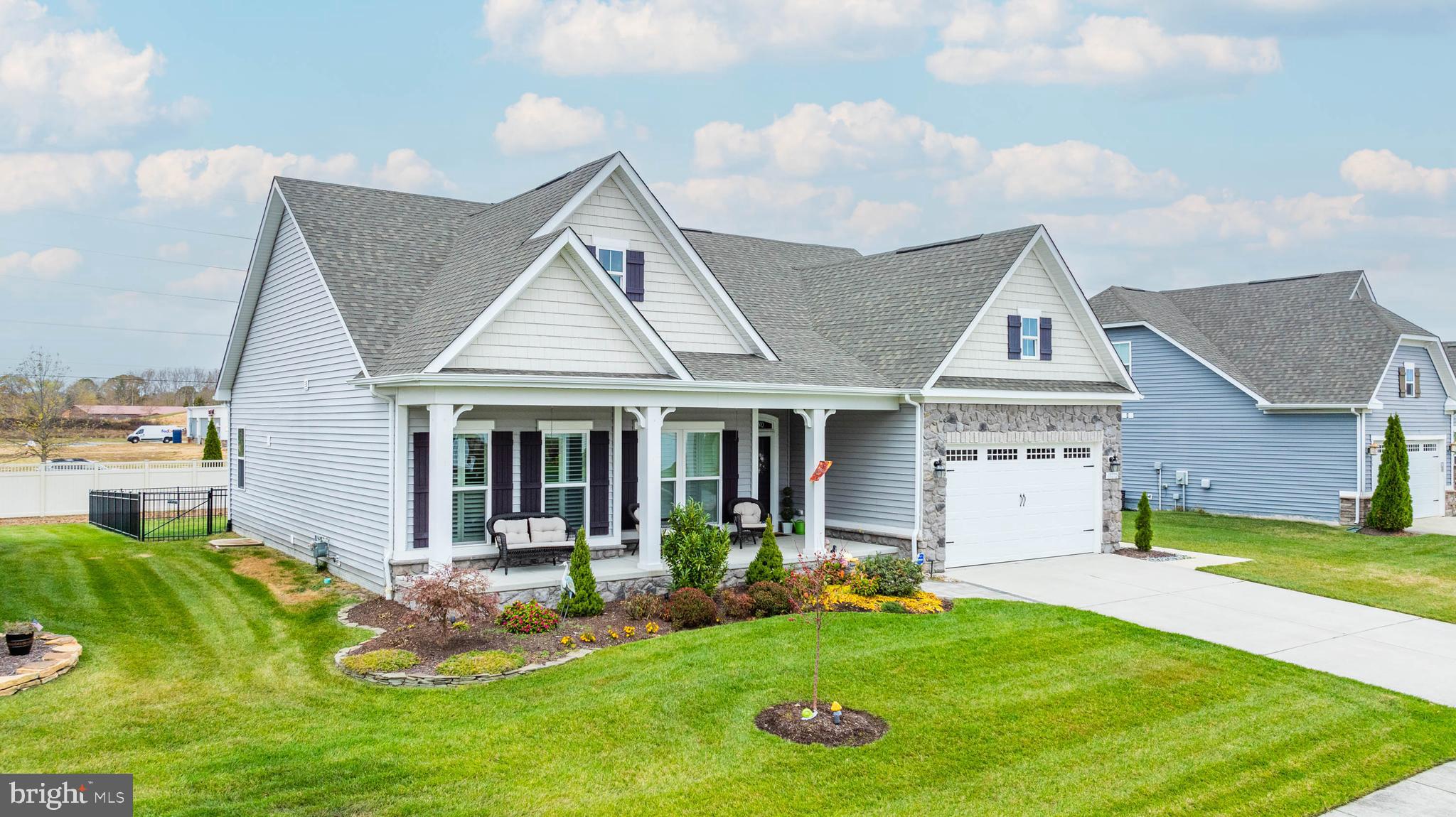 a front view of a house with a yard and porch