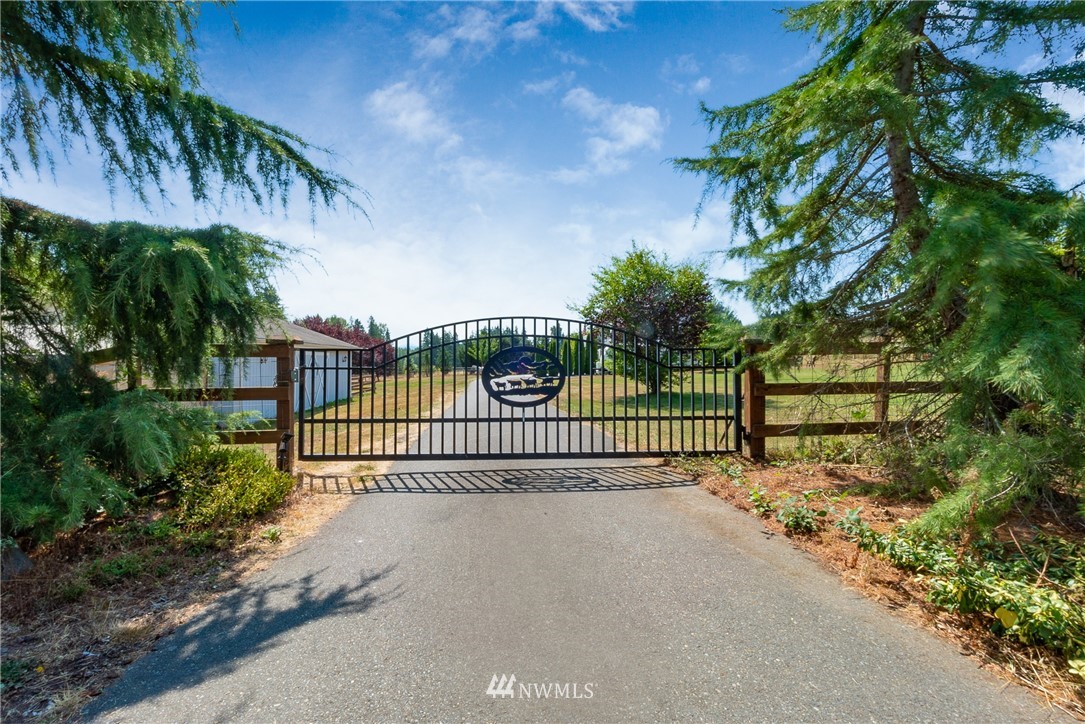 a view of a gate and fence