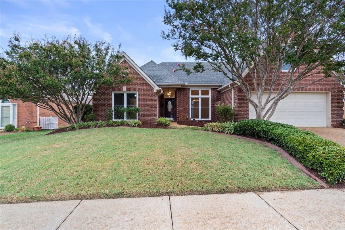 front view of a house with a yard