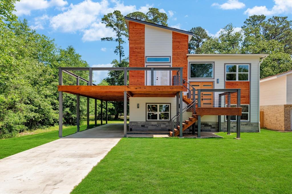 a backyard of a house with a garden and barbeque oven