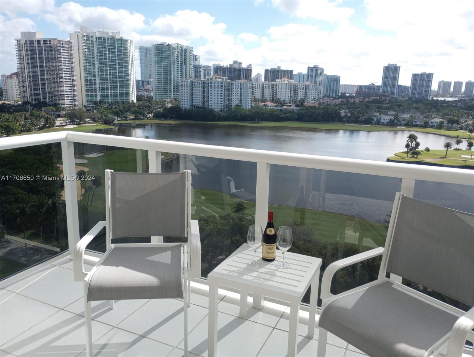 a view of swimming pool with outdoor seating and city view