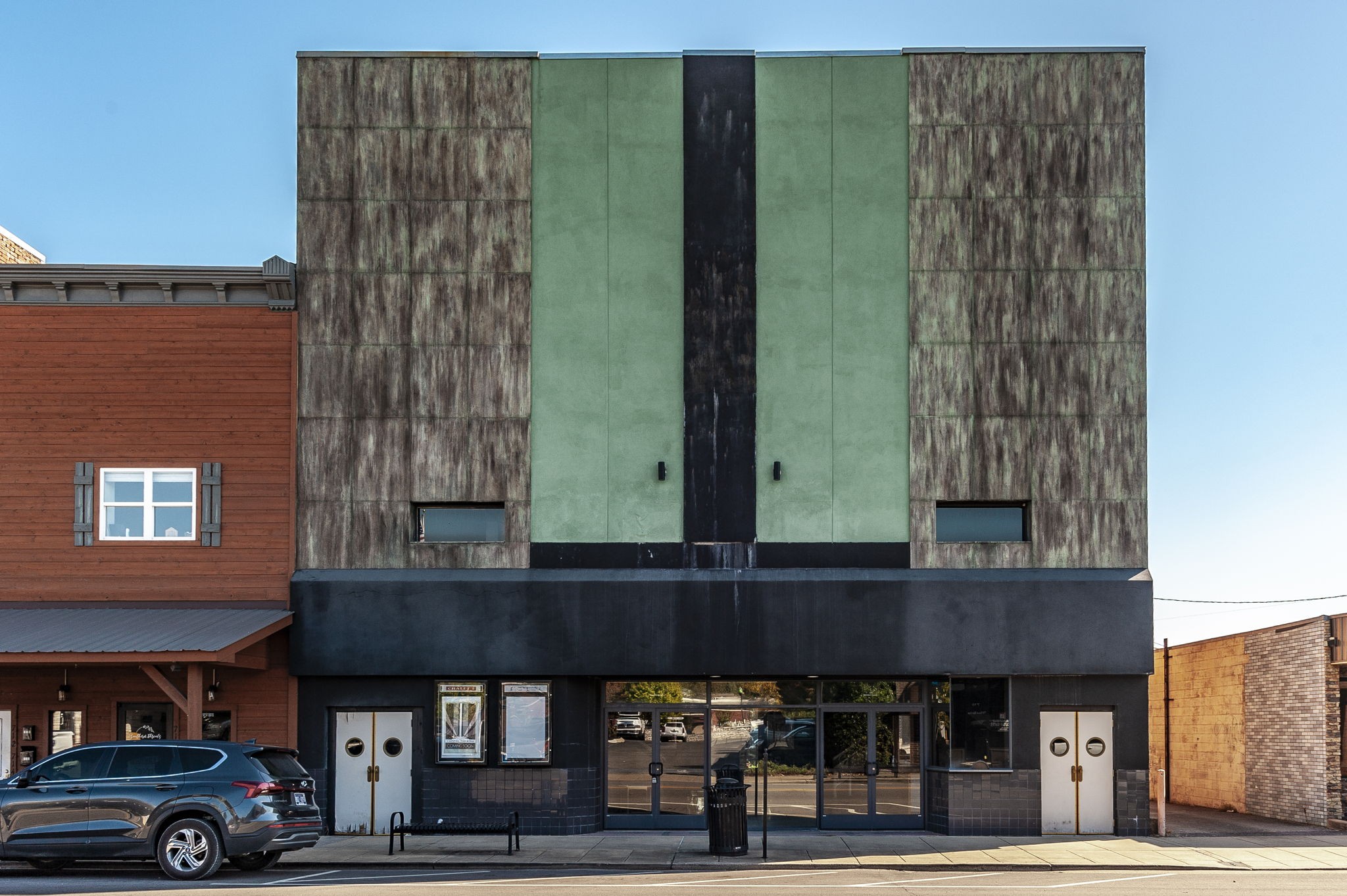 a front view of a building with parking area