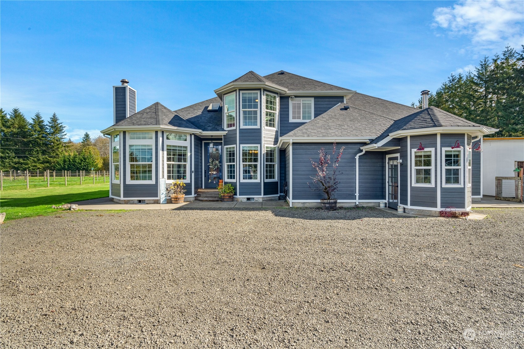 a front view of a house with a garden