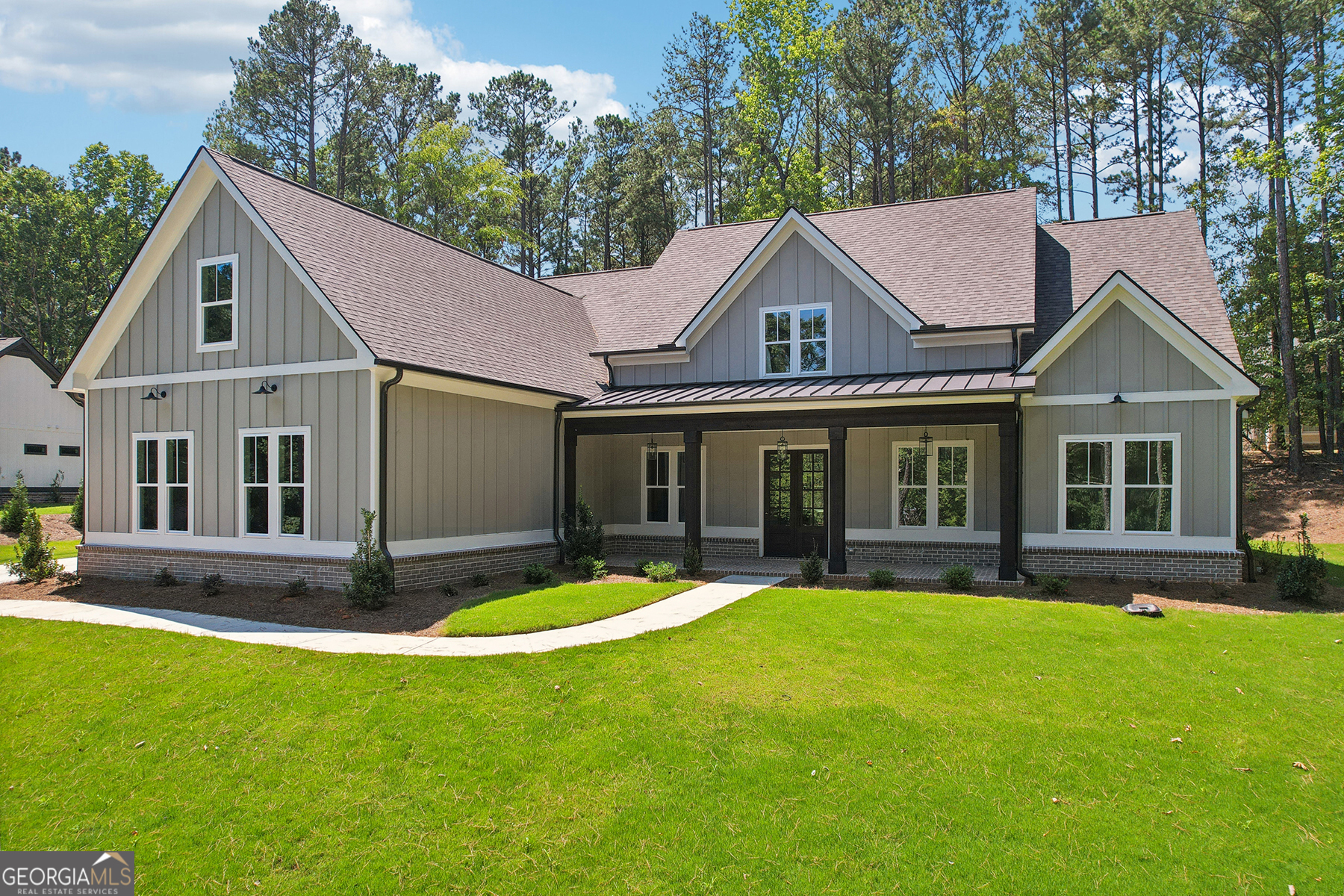 front view of a house with a yard