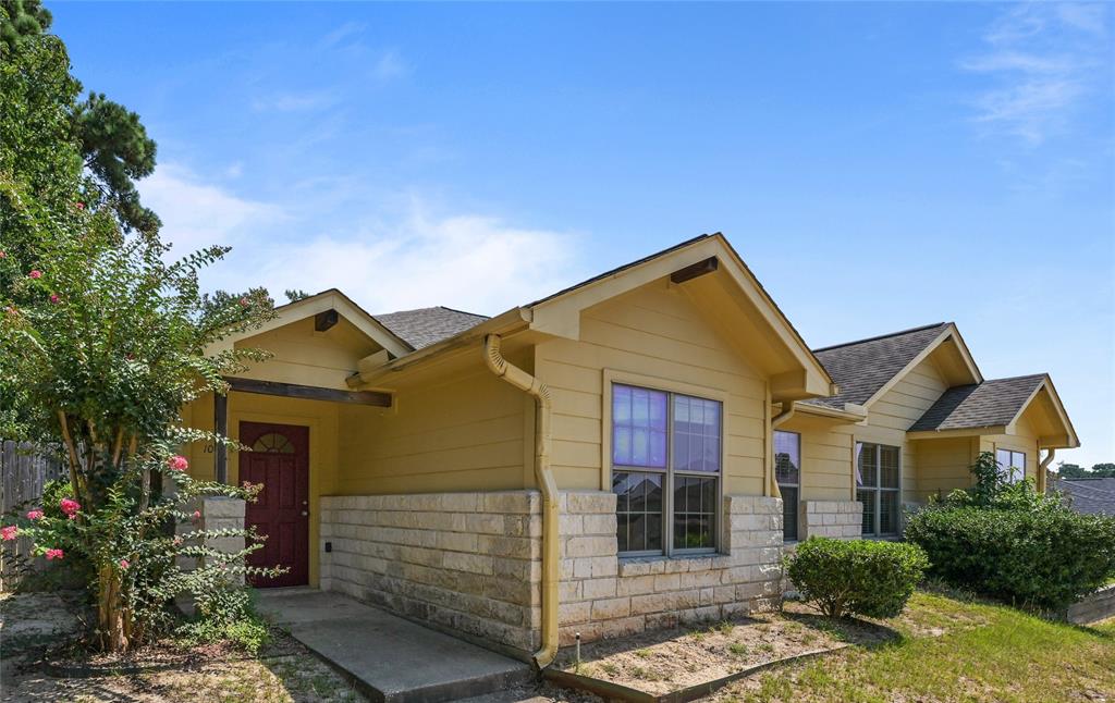 front view of a house with a yard