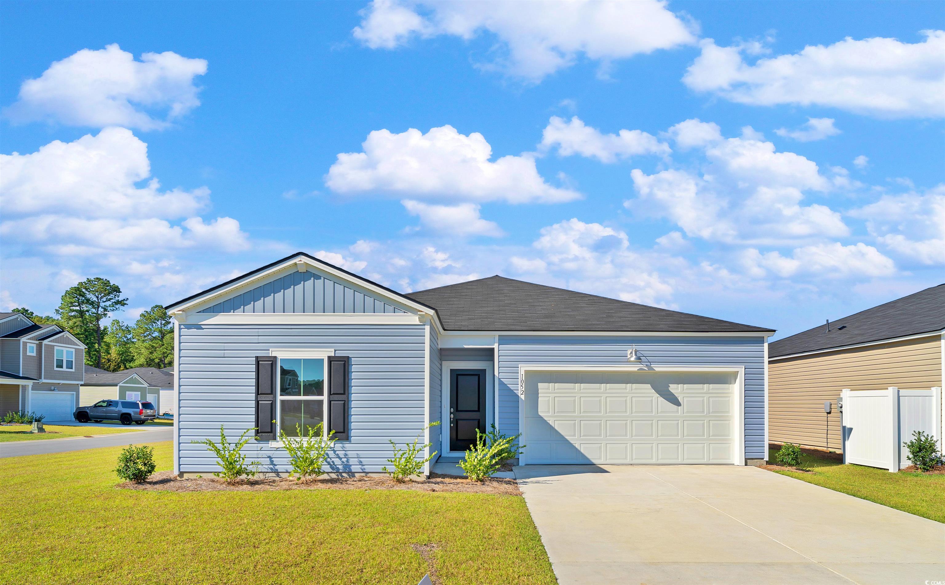 View of front of home featuring a garage and a fro