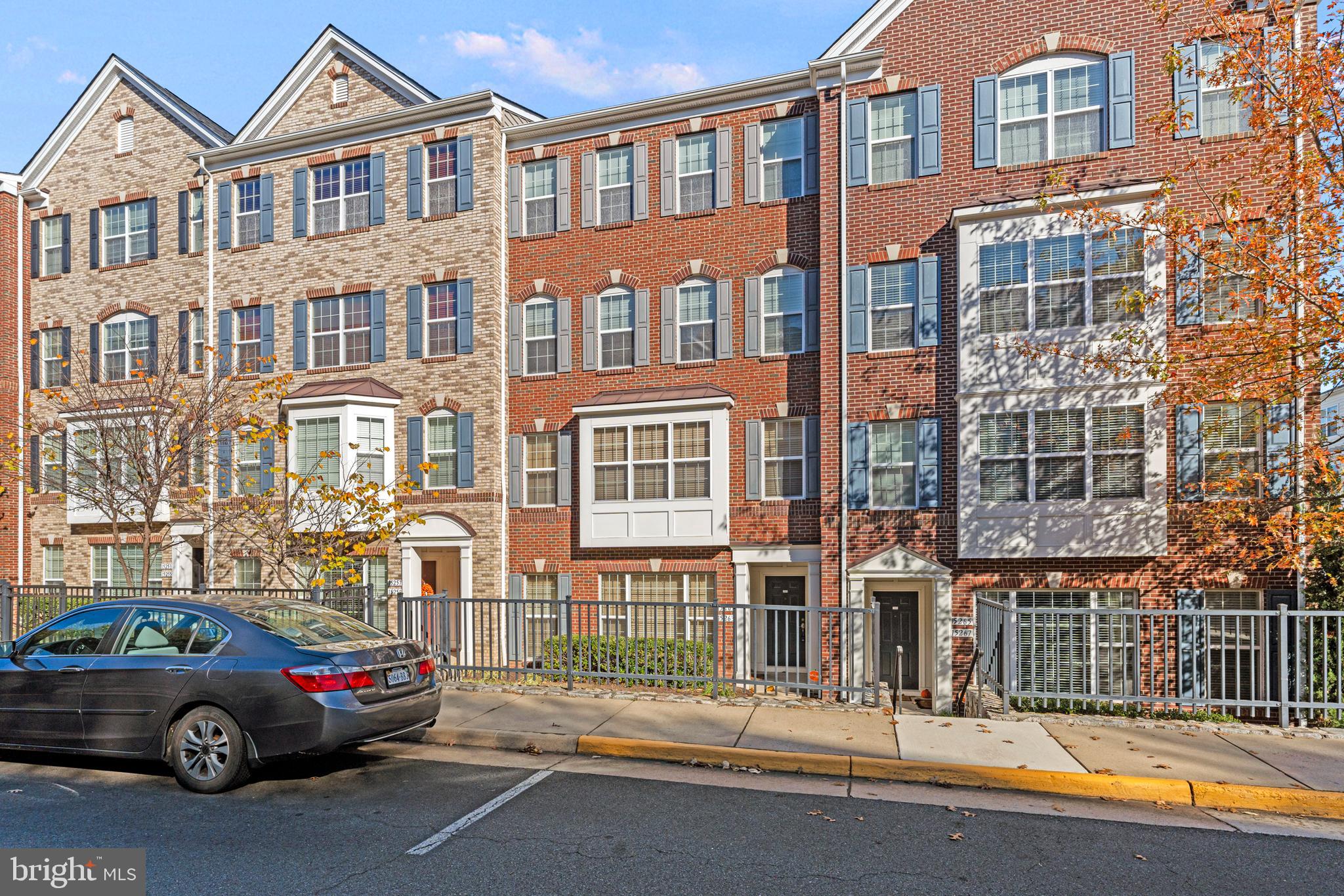 a view of a car parked in front of a building