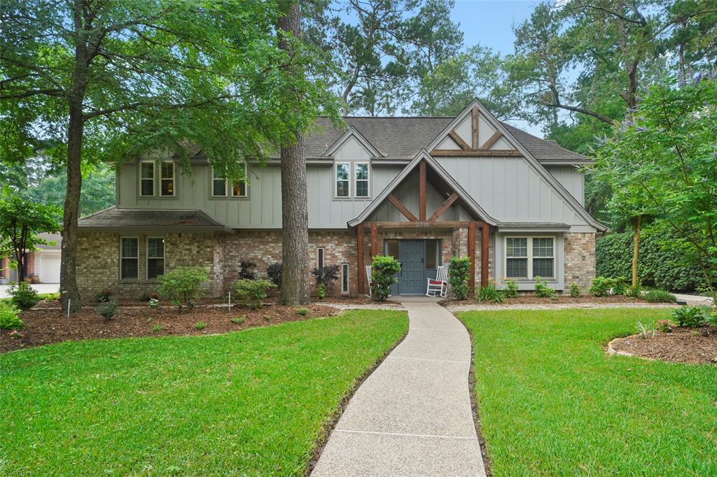 Just look at this charming curb appeal.  New covered patio with cedar and new hardyplank. Notice the new windows.