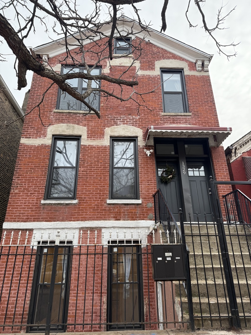 a front view of residential houses with stairs