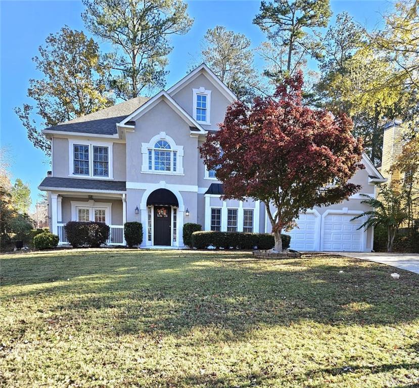 a front view of a house with a yard