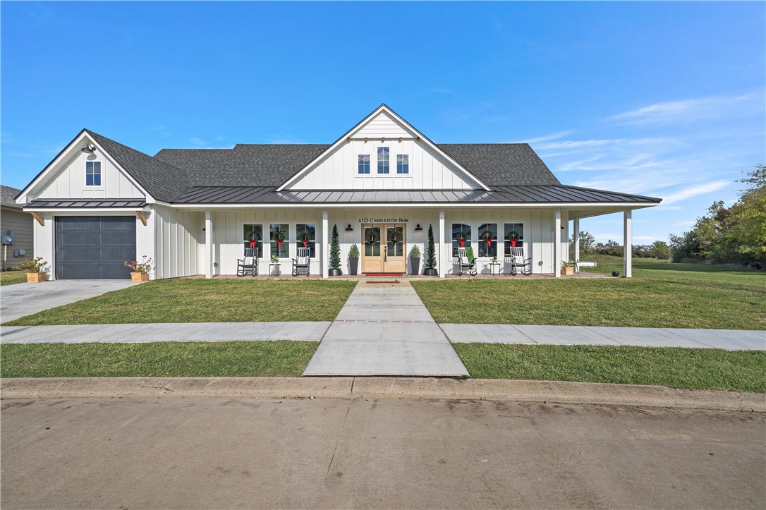 front view of a house next to a yard