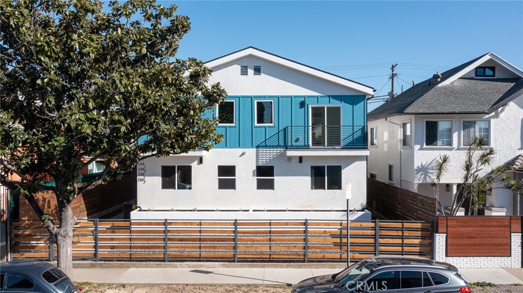 a front view of a house with parking space