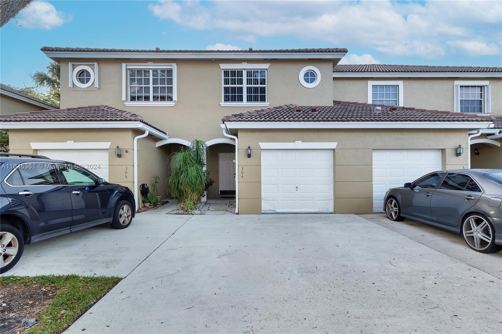 a view of a car in front of a house