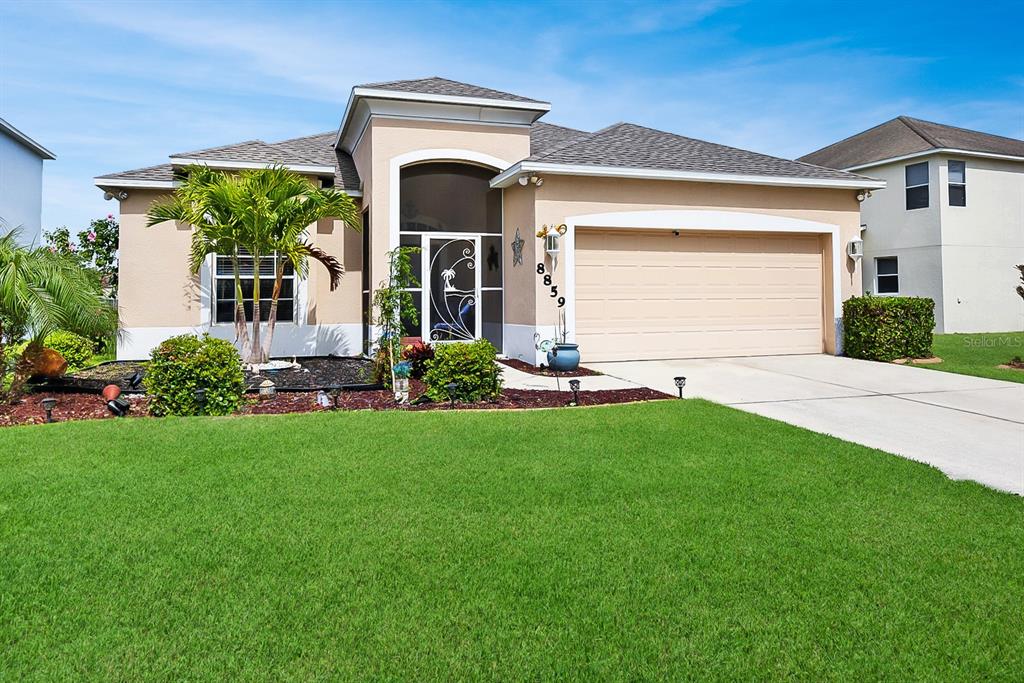 a front view of house with yard and green space