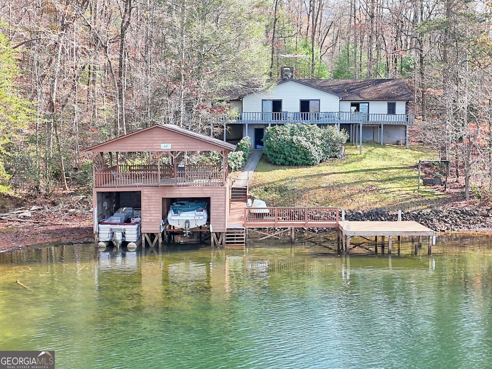 a swimming pool with outdoor seating and yard