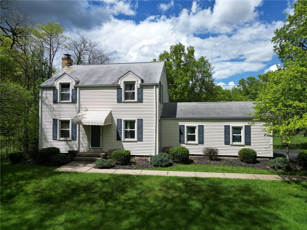 front view of a house with a yard