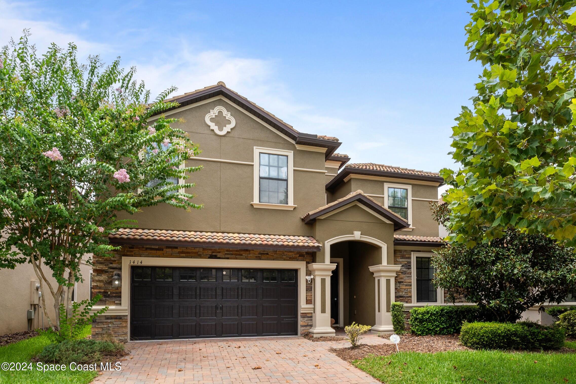 a front view of a house with yard