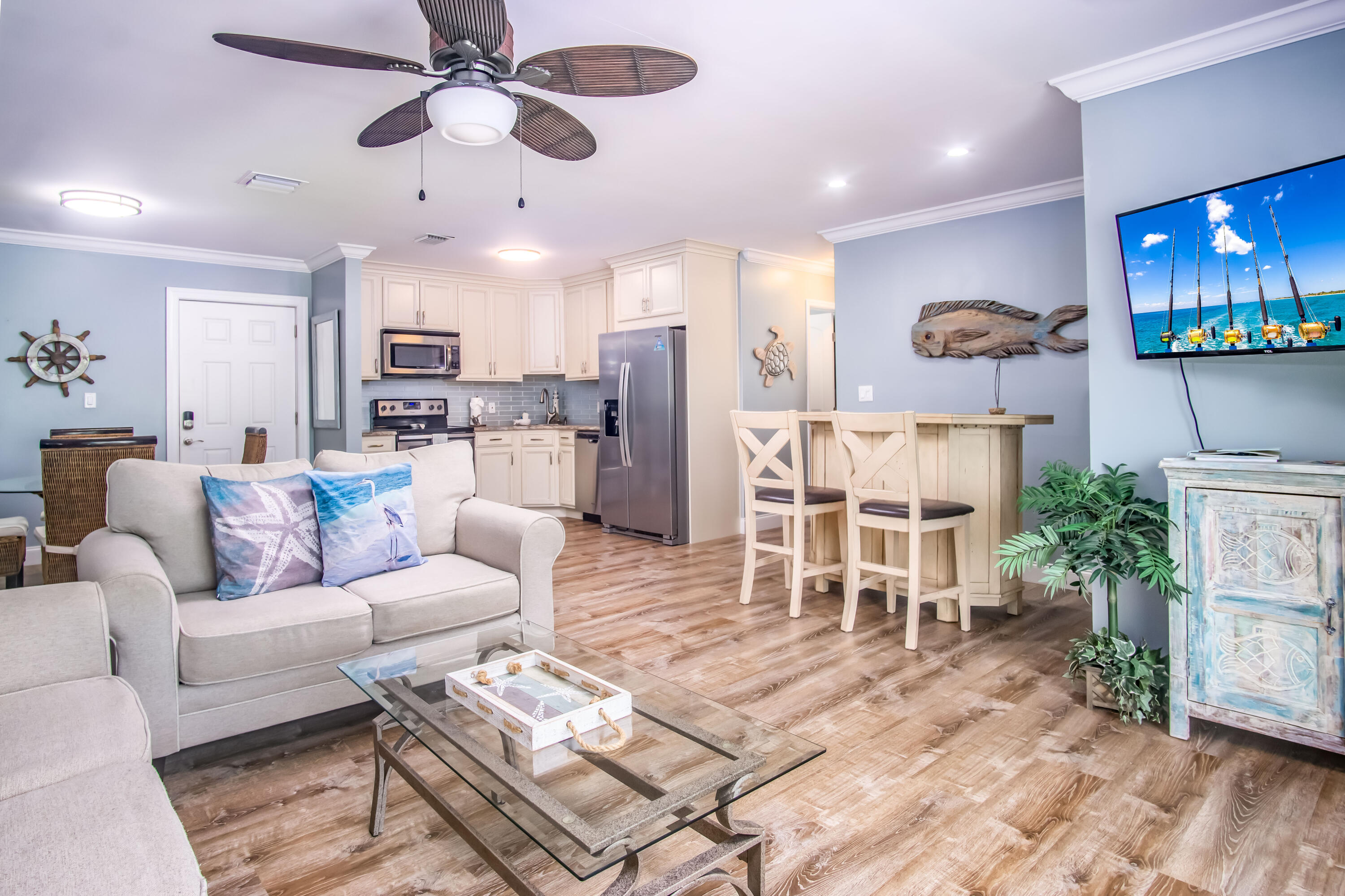 a living room with furniture and a flat screen tv