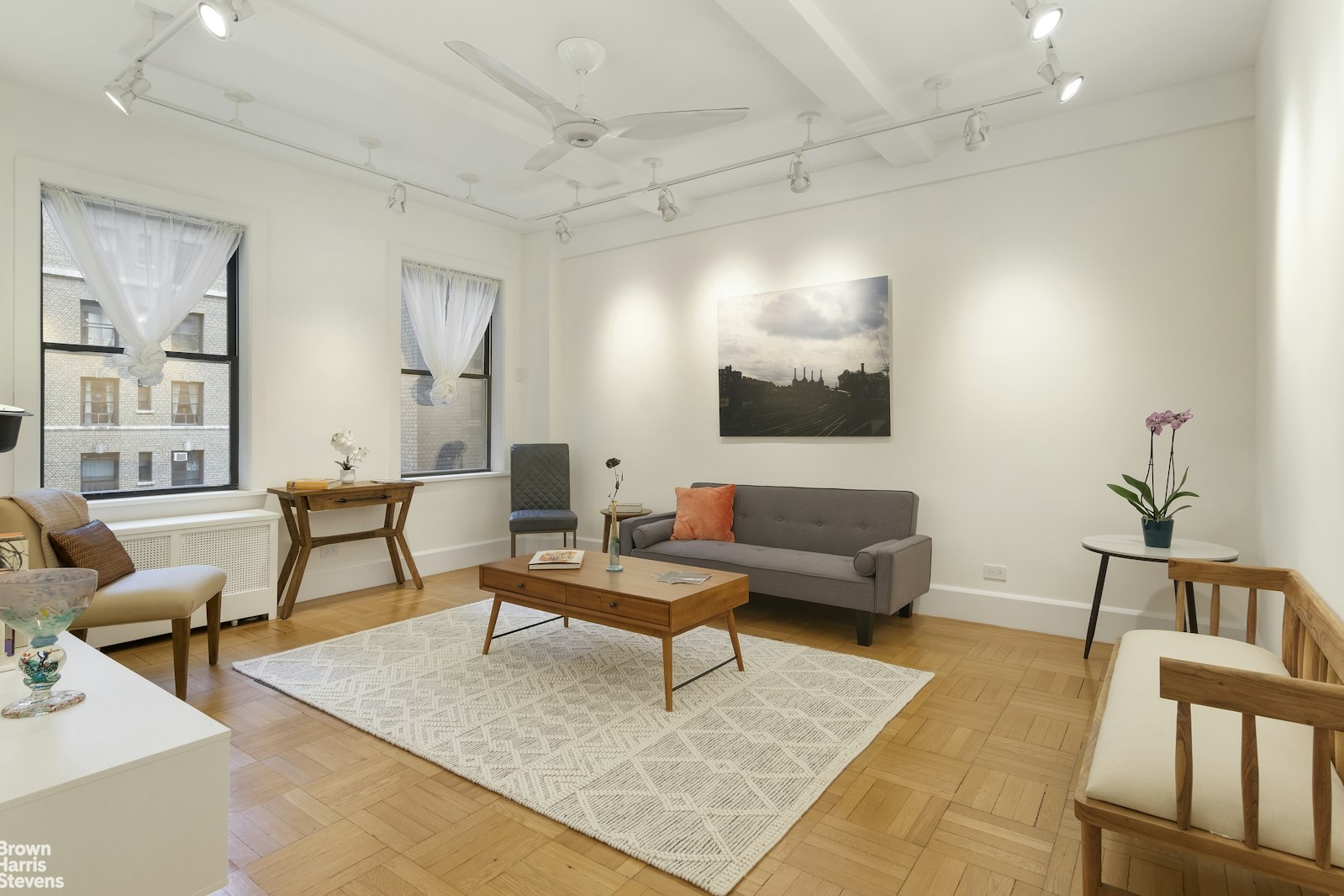 a living room with furniture and a rug