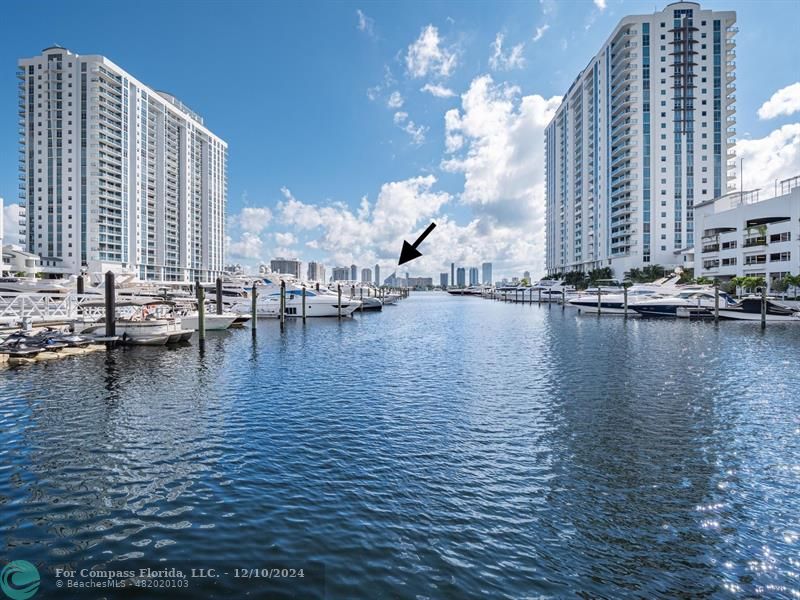 a view of an ocean with building in the background