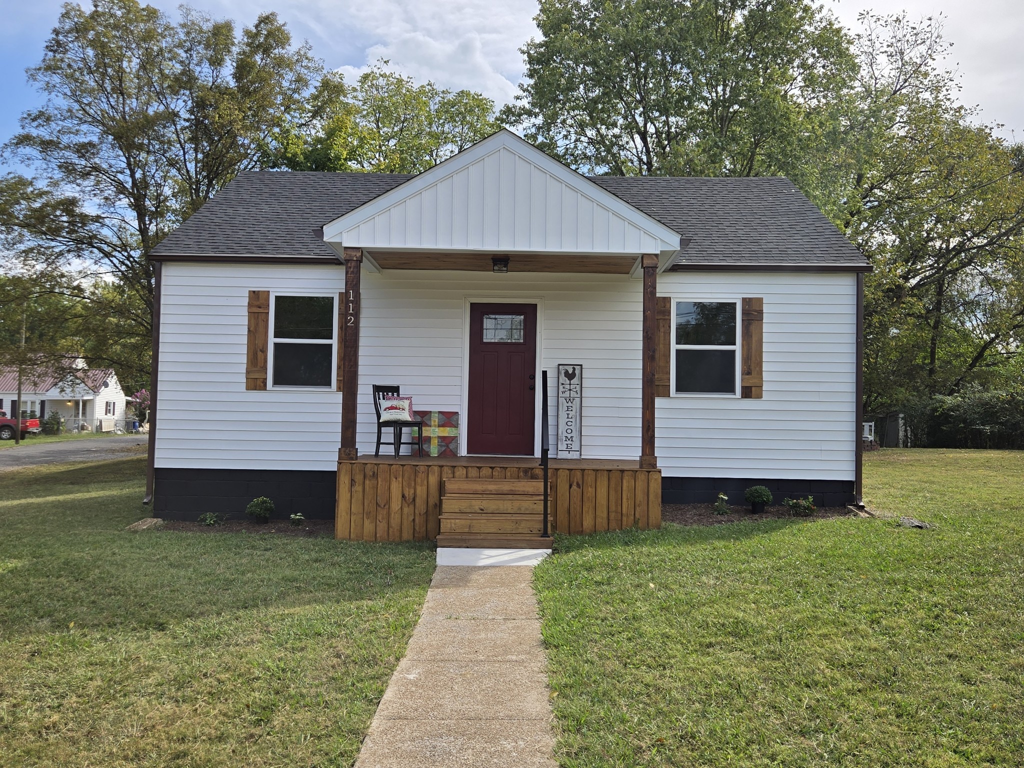 a front view of a house with a yard