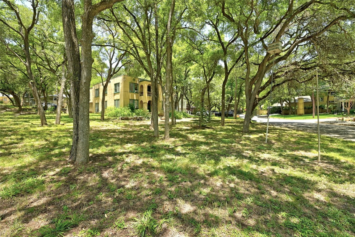 a large building with trees in the background