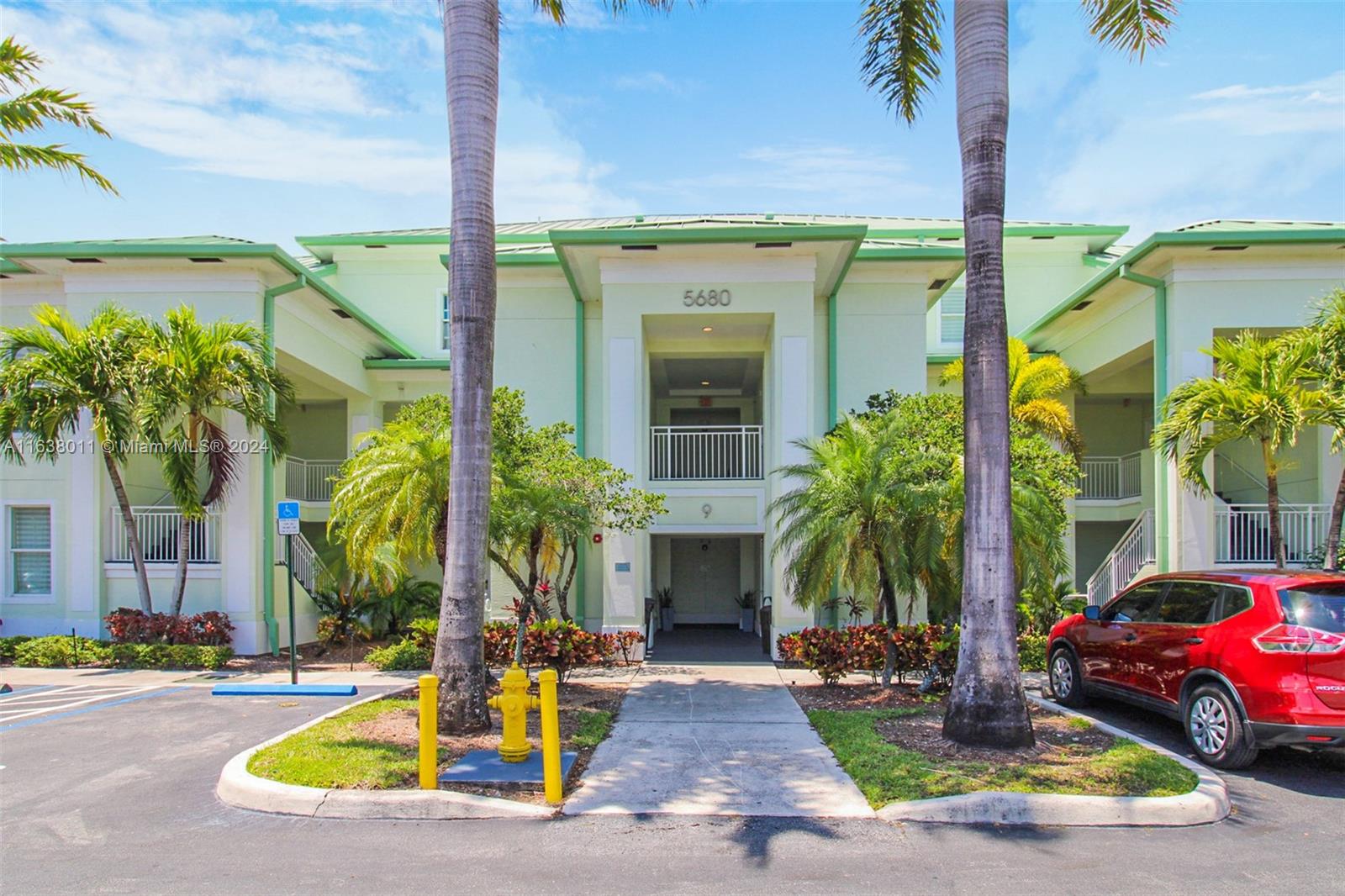 a view of front of house with a swimming pool