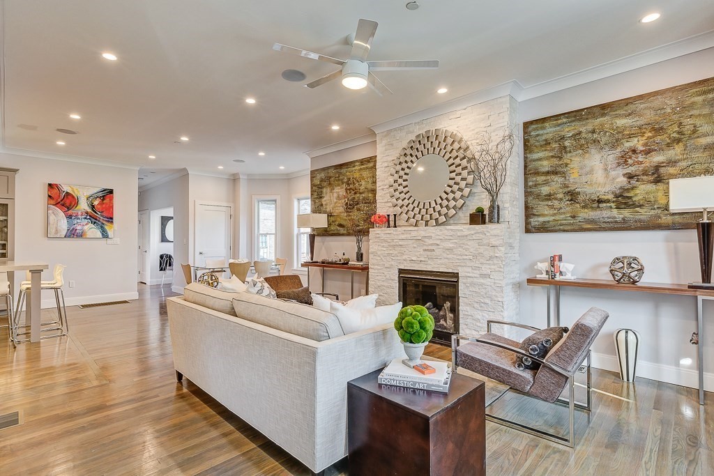 a living room with furniture and a fireplace