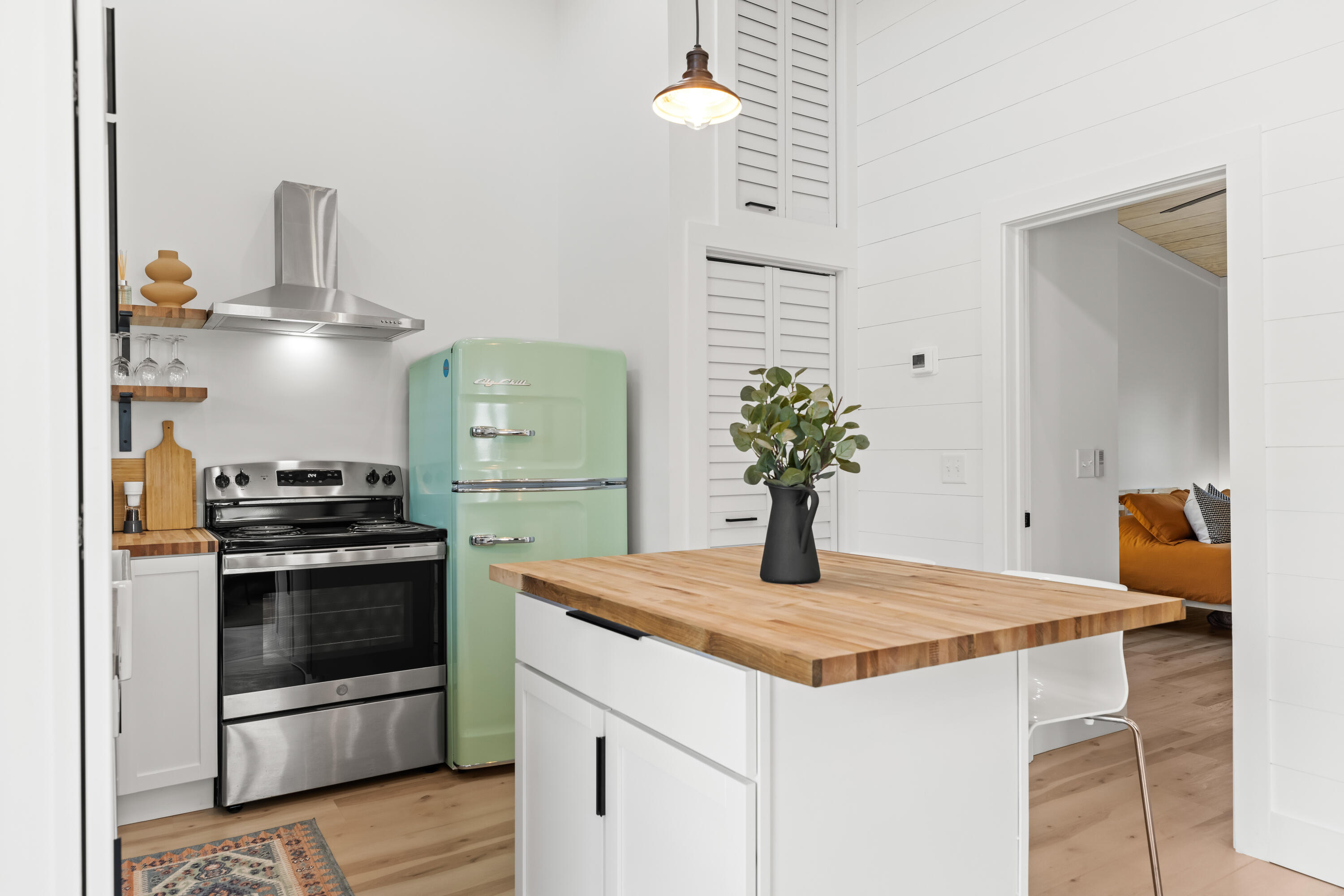 a kitchen with stainless steel appliances granite countertop a sink and a stove