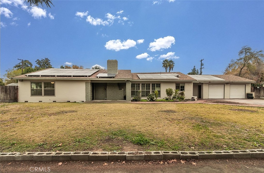 a front view of a house with yard