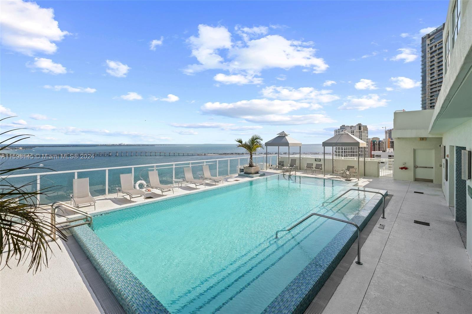 a view of a swimming pool with a lounge chair