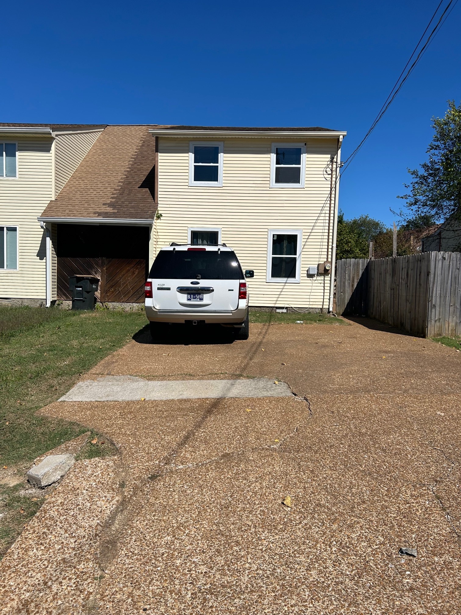 a view of a car parked in front of a house