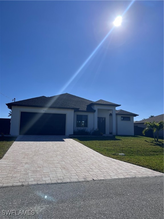 a front view of house with yard and trees