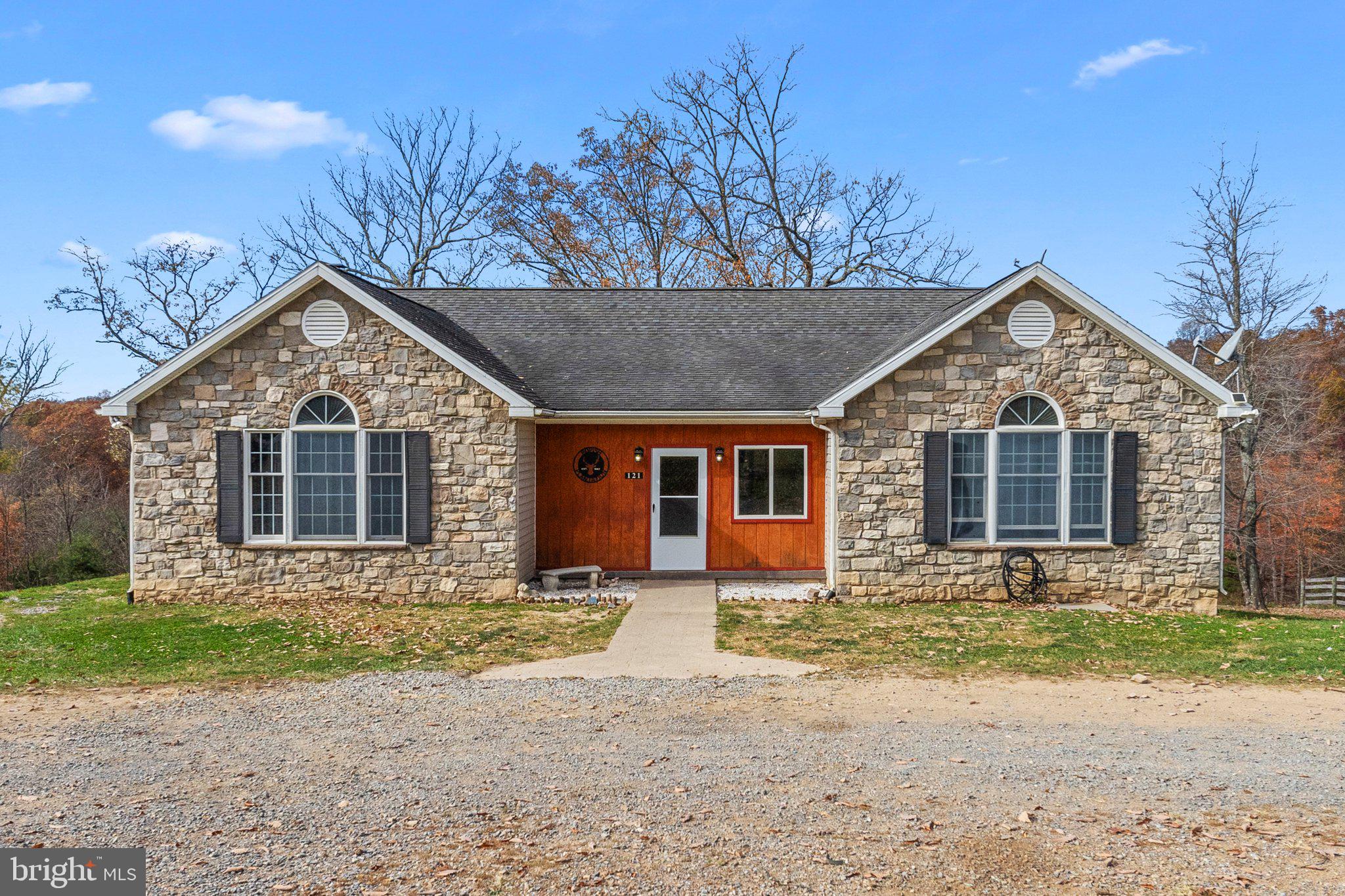 a front view of a house with yard