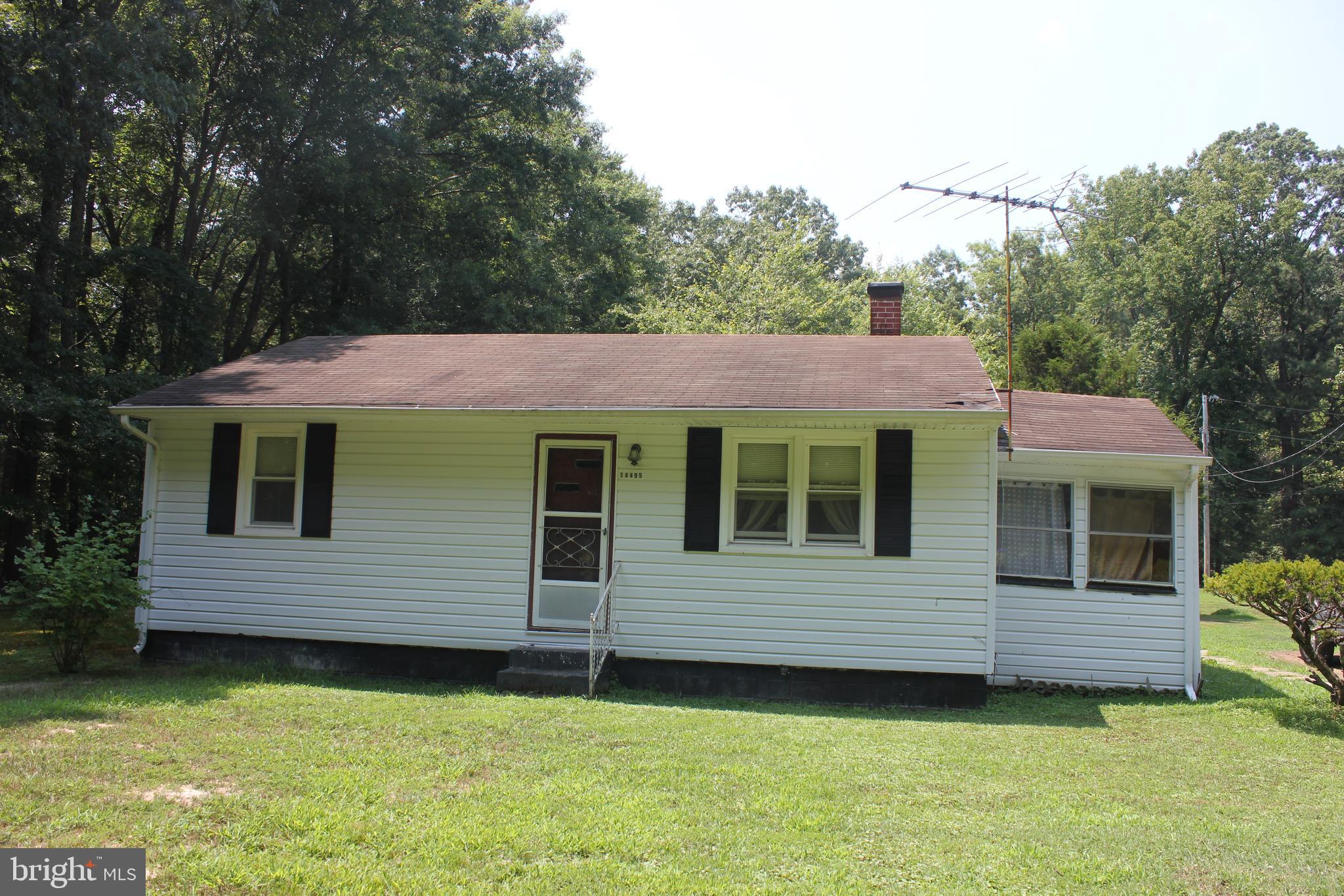 a view of a house with a garden