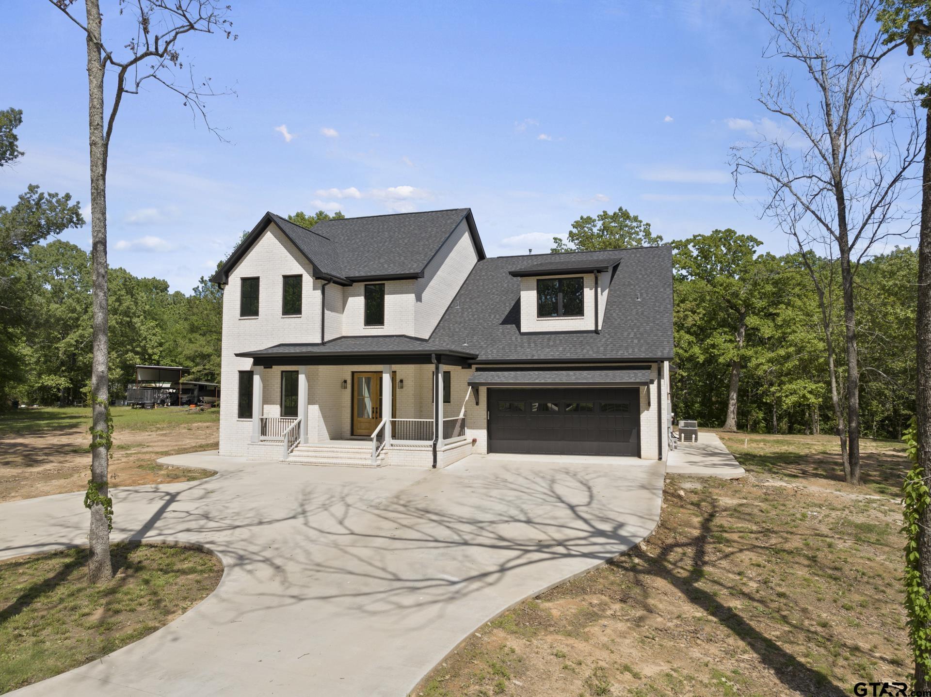 a house with trees in the background