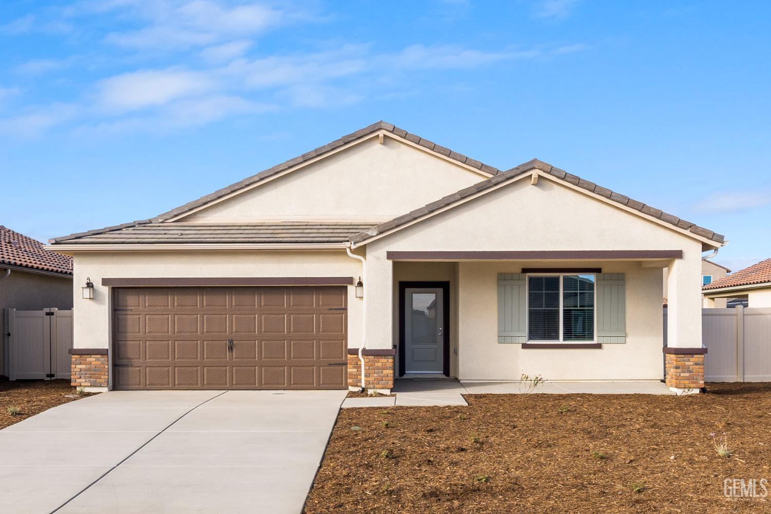 a front view of a house with a garage