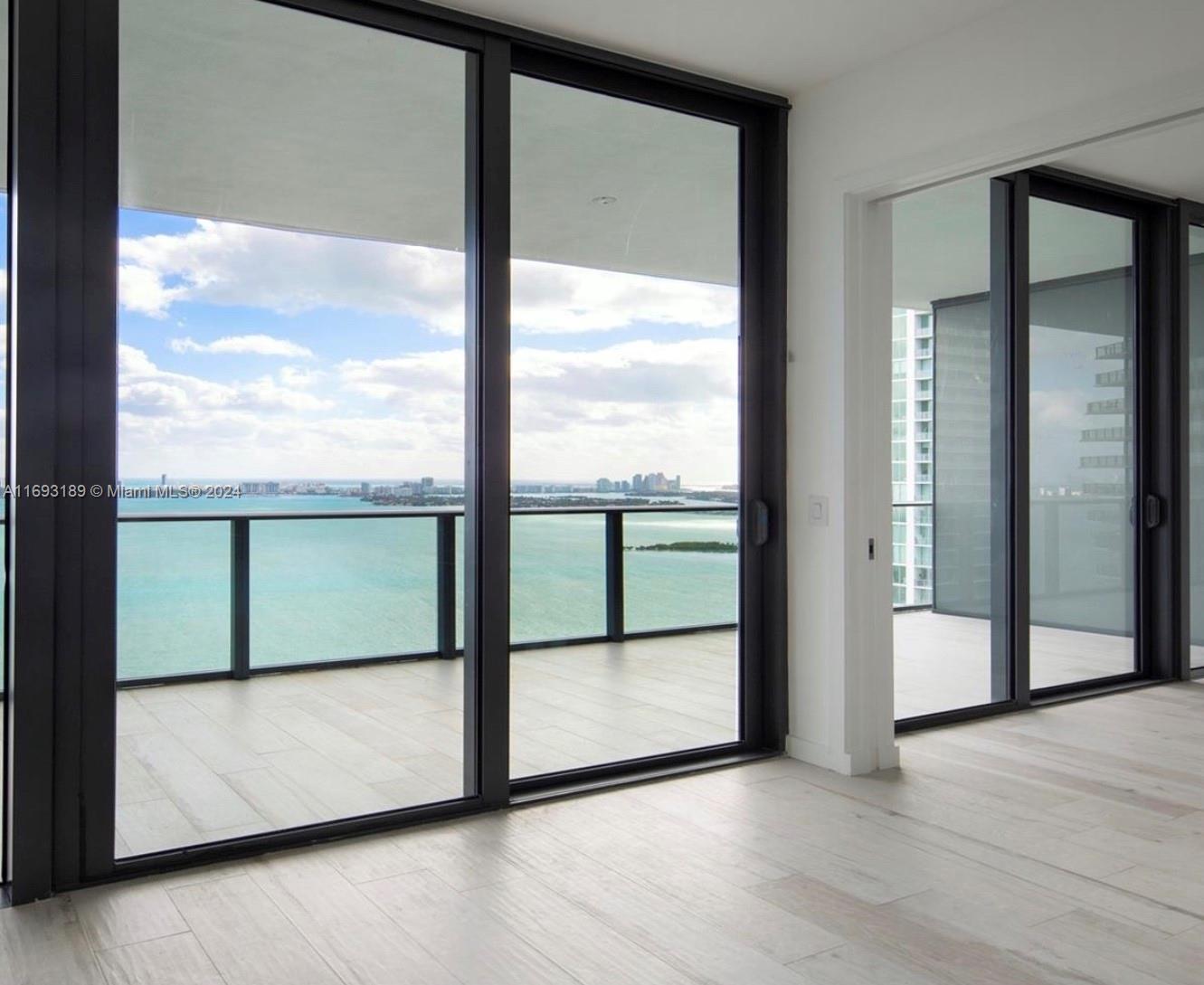 a view of a glass door with a outdoor space