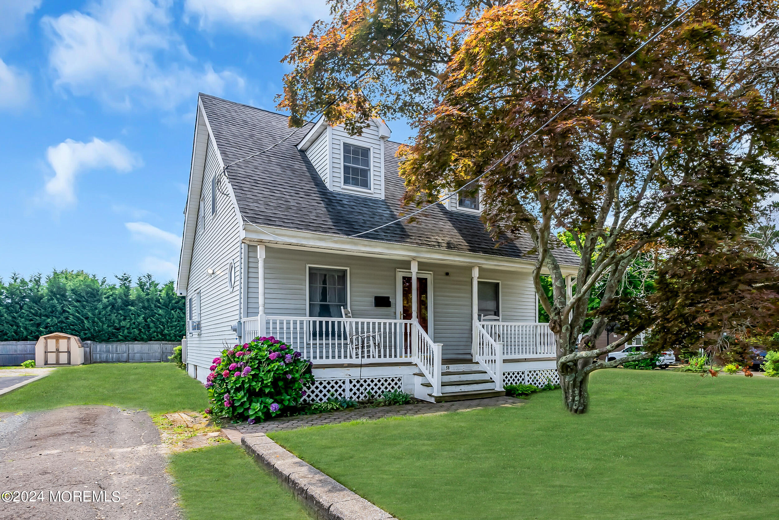 a view of a house with a yard and a garden