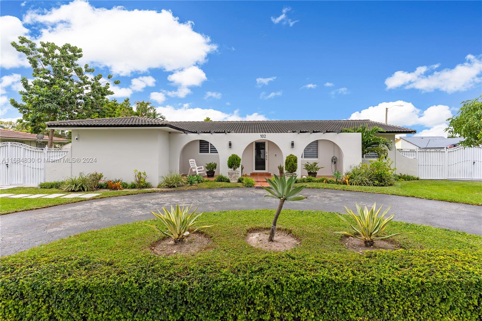 a house view with a garden space