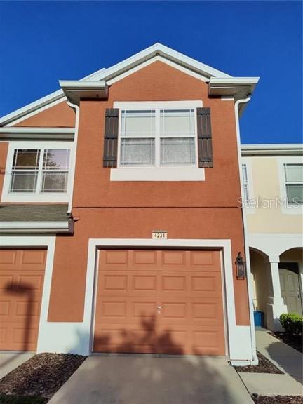 a view of a house with large windows