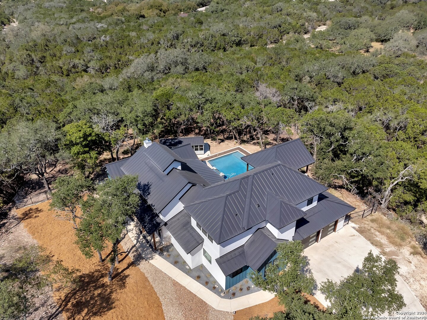 an aerial view of house with yard