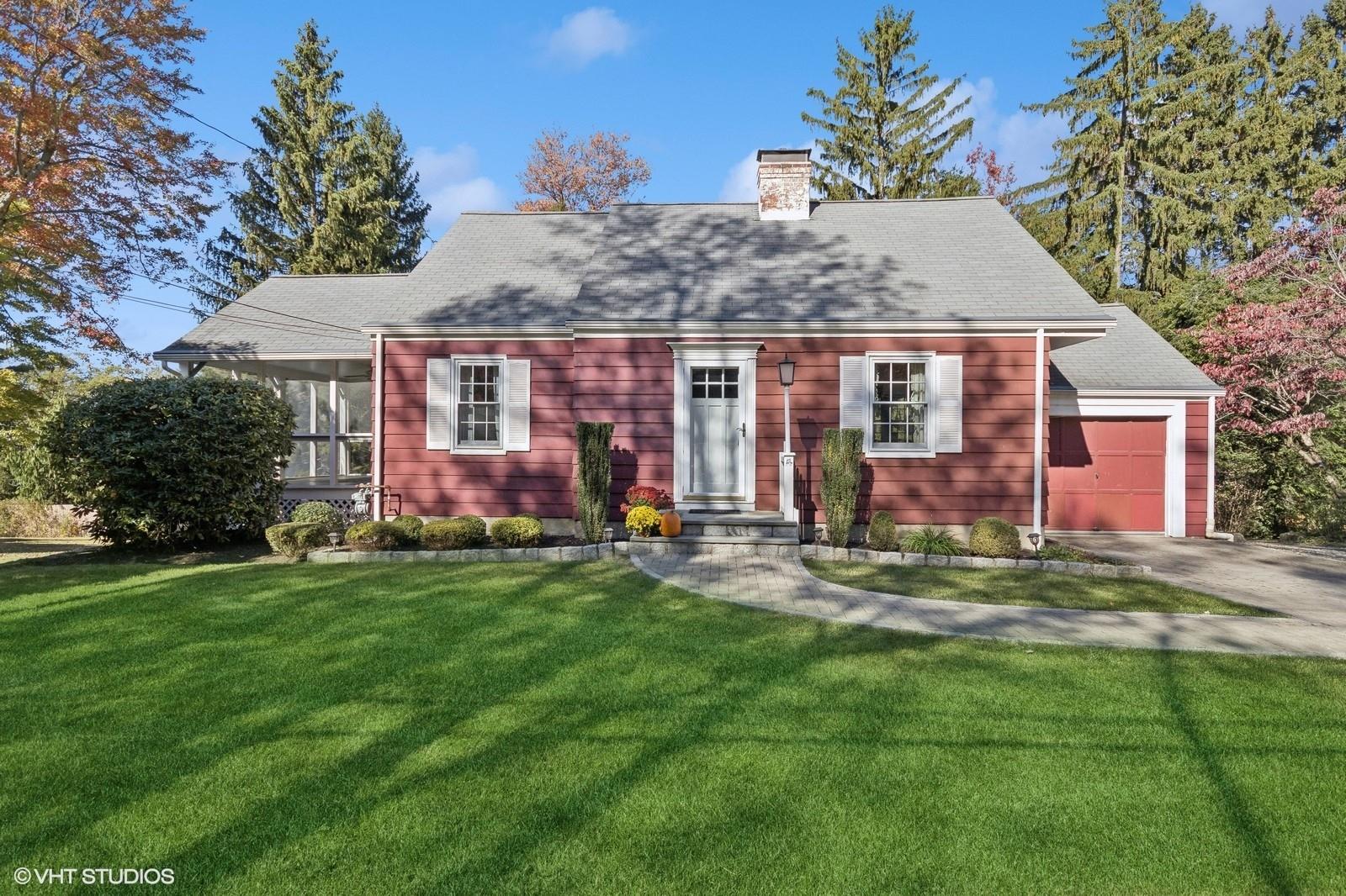 front view of a house with a yard