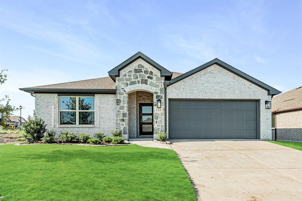 front view of a house with a yard