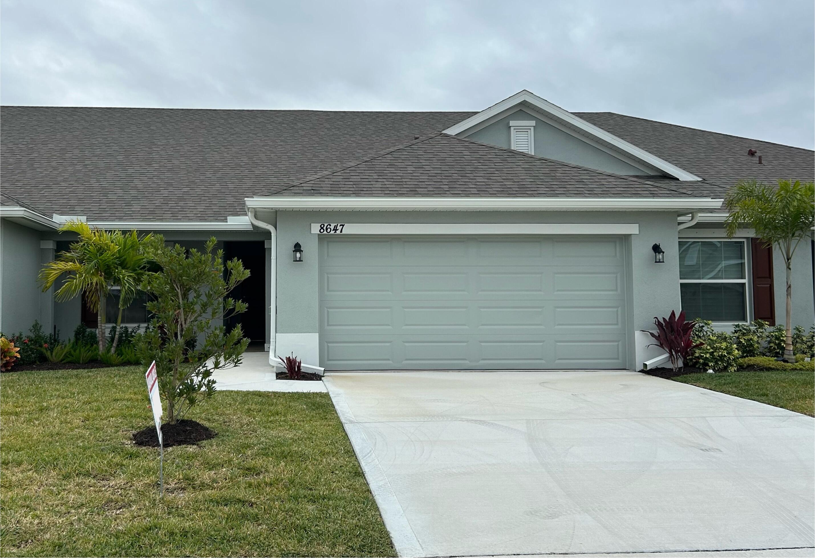 a front view of house with a yard