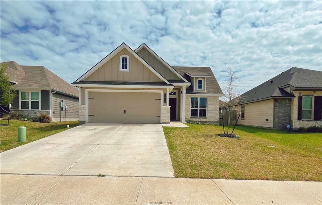 a front view of a house with yard