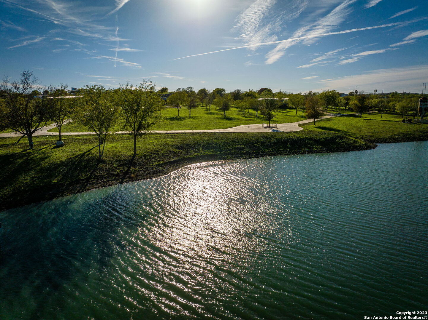 a view of a golf course with a lake