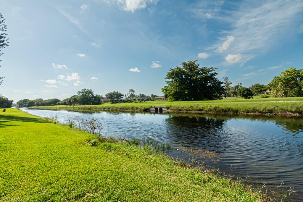 a view of a lake with a house in the background